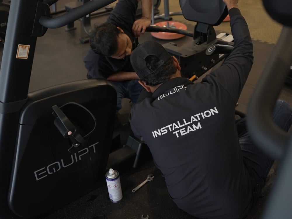 An Equipt technician servicing equipment under an annual maintenance contract.